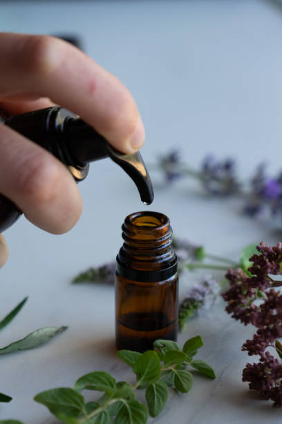 istock Bottle of essential oils being refilled 1648189352