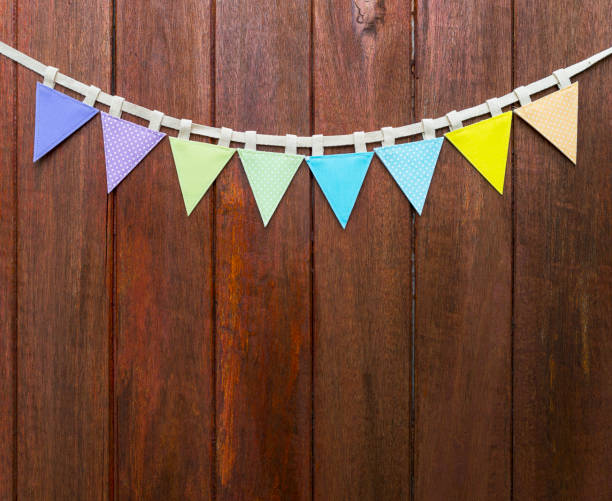 istock Colorful fabric bunting flag on wood background 1648190414