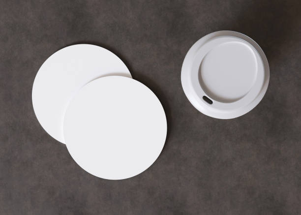 istock White, round cup coaster mock up. Blank template for your design, advertising, logo. Top view, close-up. Copy space. Drink mat, pad. Minimalist mockup. 3D rendering. 1648190992
