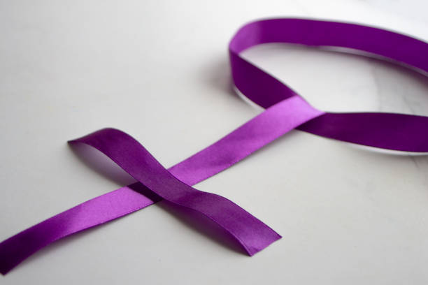istock Feminine symbol made with a purple bow 1648191522