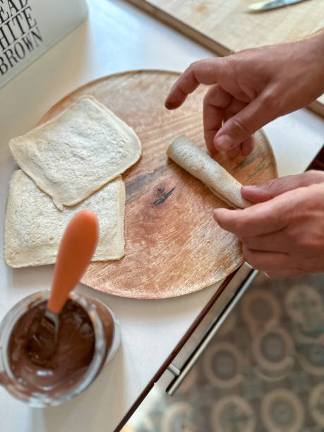Hands preparing a simple chocolate sushi recipe