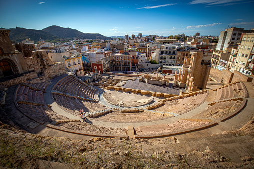 General view of the Roman theater in Cartagena, Region of Murcia, Spain, with the city in the background