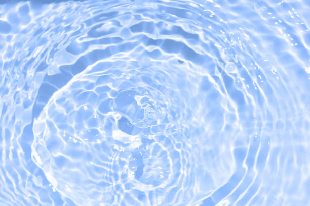 istock Blue water with ripples on the surface. Defocus blurred transparent blue colored clear calm water surface texture with splashes and bubbles. Water waves with shining pattern texture background. 1648217118
