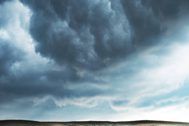 dramatic sky with black clouds - the calm before the storm. - storm summer forest cloudscape imagens e fotografias de stock