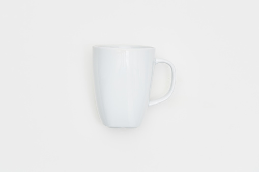 Single white coffee cup on white background
