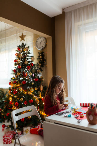 istock Creative little girl doing some crafting for Christmas holidays 1648260279