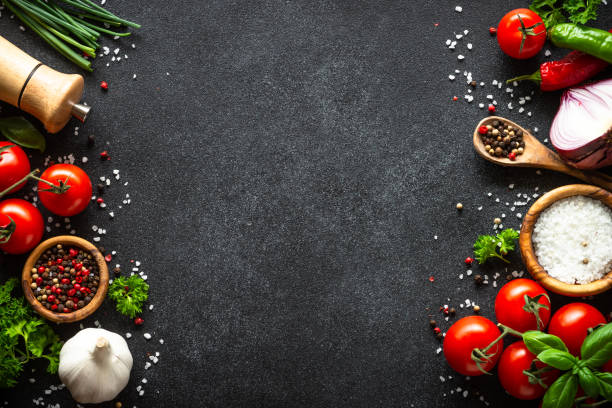 istock Food cooking background on black stone table. 1648265133