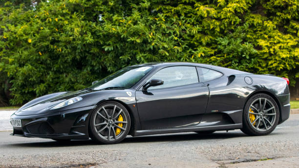 Ferrari F430 Whittlebury,Northants,UK -Aug 27th 2023: 2010 black FERRARI F430 SCUDERIA S-A   car travelling on an English country road ferrari ferrari f430 italian culture action stock pictures, royalty-free photos & images