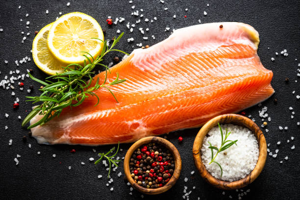 istock Fresh salmon fish at black top view. 1648270105