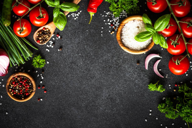 istock Food cooking background on black stone table. 1648276044