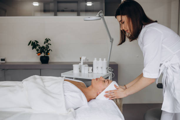 istock Cosmetologist is a professional with a patient in the office of. 1648277227