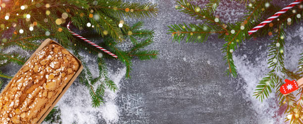 istock Christmas banner with copy space. Banner with spruce branches and lights, snow 1648317997