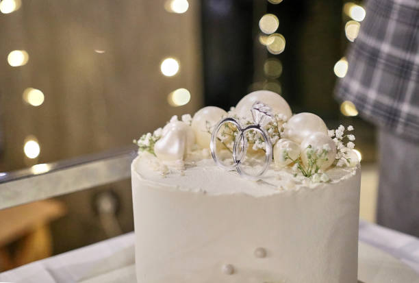 istock Beautiful wedding cake with elements of wedding rings. Wedding celebration. 1648333587