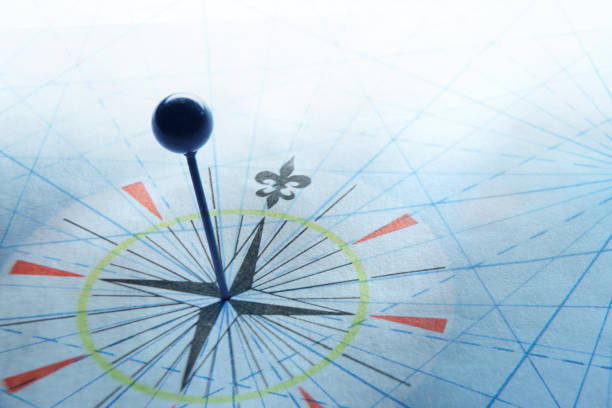 istock Push Pin In Middle Of Compass Rose 1648341154