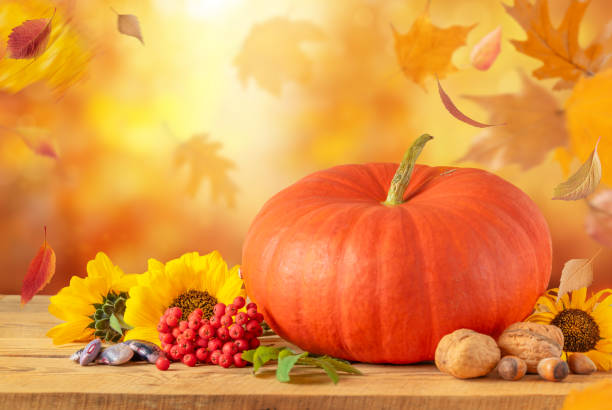 istock Festive autumn background with pumpkin and fallen leaves, copy space. 1648343888