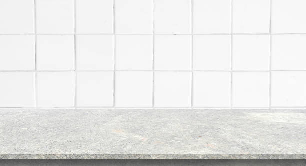 istock white ceramic square pattern background of modern interior bathroom with gray color cement table perspective for show ,promote and advertise content or product on display 1648358584
