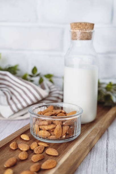 istock Almond milk in a glass bottle in white kitchen. 1648365791
