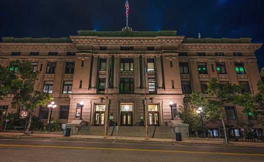 Night view of an entrance to a historic building in downtown Butte, Montana, USA