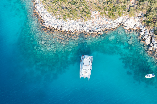 Aerial view of  Yacht anchor in cove Kas, Antalya with by drone