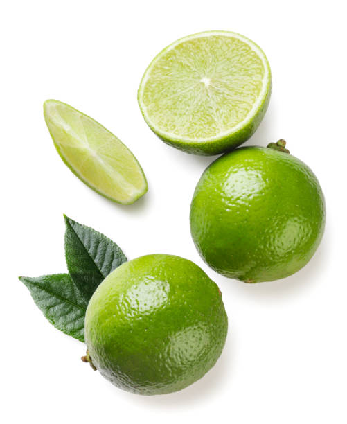 istock Lime with leaves, half and piece close-up on a white. Top view 1648447424