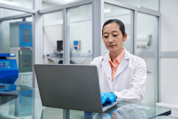 istock Female medical worker preparing notes at desk in laboratory 1648451028