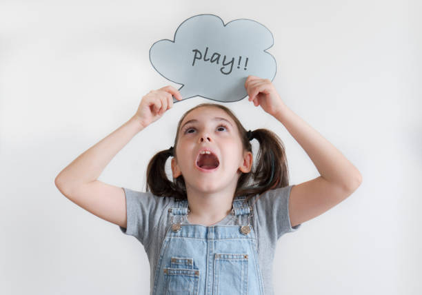 istock Beautiful girl holding speech bubble isolated on white 1648451304