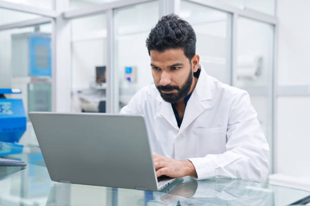istock Male medical worker preparing notes at desk in laboratory 1648451494