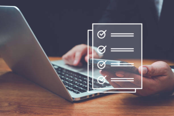 istock Business performance checklist,Quick checklist and clipboard management concept, businessman using laptop doing online checklist survey,filling out digital form checklist,take an assessment. 1648456648
