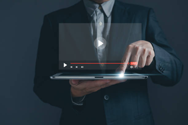 istock Businessman is using and touching tablet screen in broadcasting, digital technology, online media, and virtual video advertising and marketing concept. live streaming digital marketing 1648465947