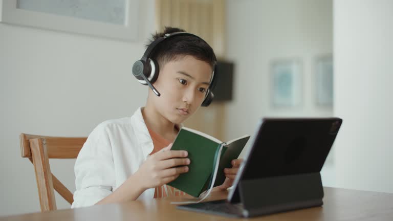 Asian Boy online learning at home