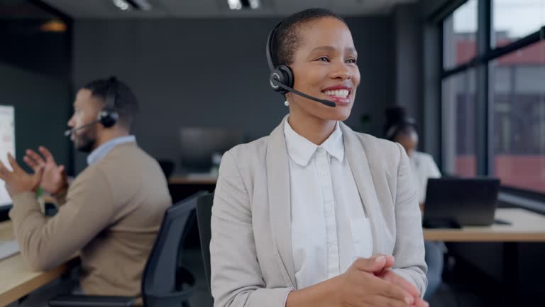 Call center, speaking and woman, consultant or agent for telemarketing communication or customer support. Workspace, telecom agency and African person talking on headphones on virtual helping chat