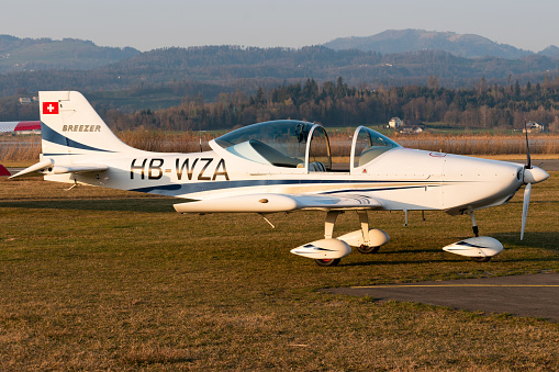 Wangen-Lachen, Switzerland, March 27, 2022 Breezer B600 propeller plane on the grass parking on a small airfield