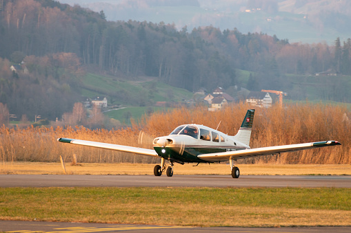 Wangen-Lachen, Switzerland, March 27, 2022 Piper PA28-161 Warrior III propeller plane is taxiing on a small airfield