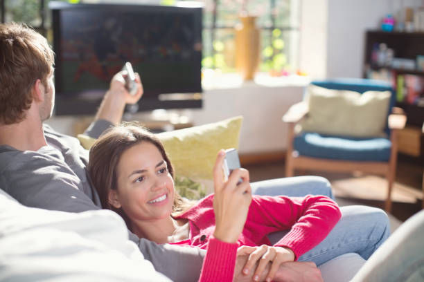 istock Couple relaxing on sofa together 164851952