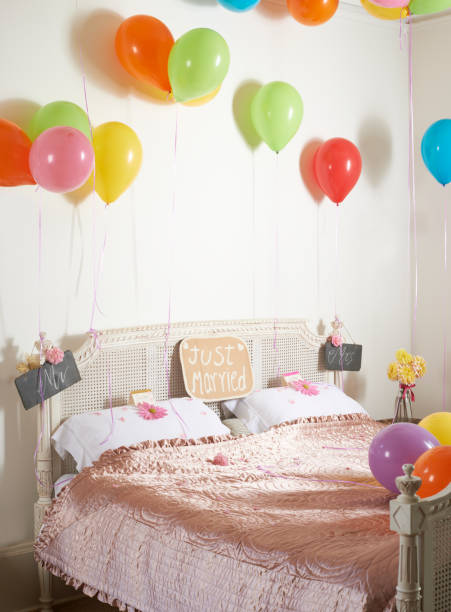 istock Colorful balloons over marriage bed 164852007