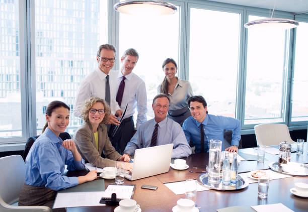 istock Business people smiling in meeting 164852254