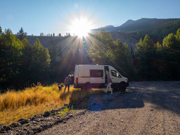 istock Mature couple leave camper van with picnic cooler 1648523252