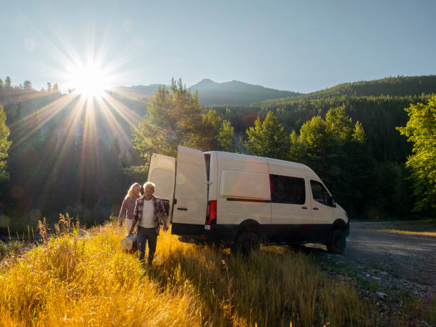 istock Mature couple leave camper van with picnic cooler 1648523267