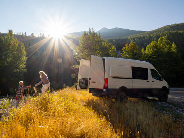istock Mature couple leave camper van with picnic cooler 1648523807
