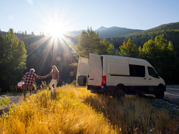 istock Mature couple leave camper van with picnic cooler 1648523817