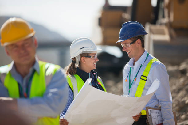 istock Business people reading blueprints in quarry 164852592