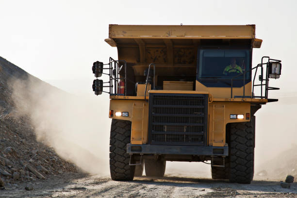 istock Machinery driving on road in quarry 164852602