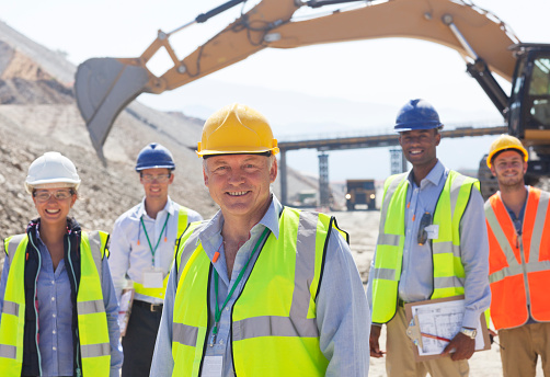 Happy man, architect and city for construction management or teamwork in leadership on site. Portrait of male person, contractor or engineer smile for professional architecture, project or ambition