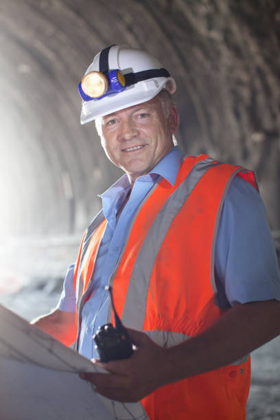 istock Businessman reading blueprints in tunnel 164852739