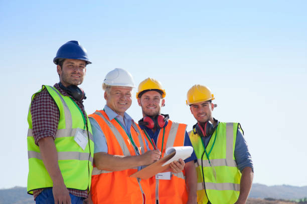 istock Businessman and workers smiling on site 164852780