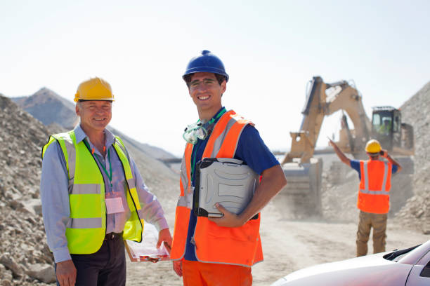 istock Worker and businessman standing in quarry 164852816