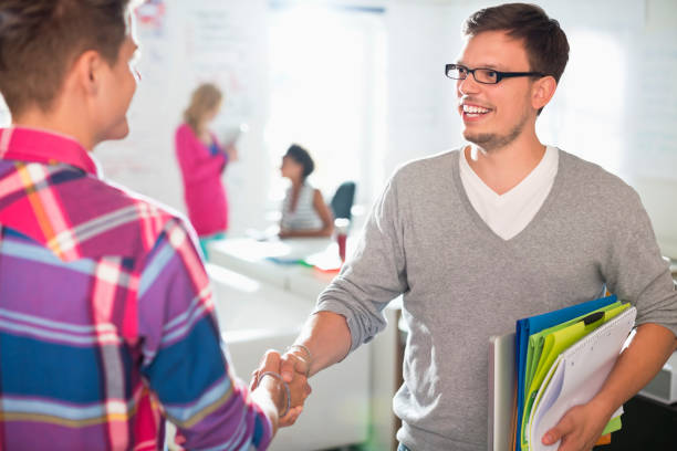 istock Businessmen shaking hands in office 164852924