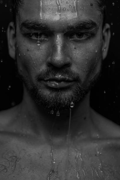 istock Beautiful male studio portrait with water 1648529889