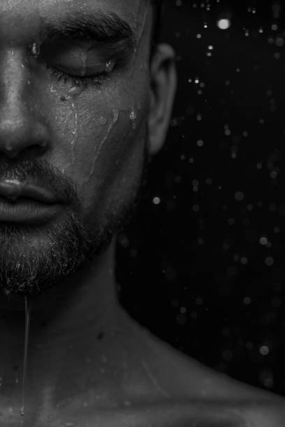 istock Beautiful male studio portrait with water 1648529897