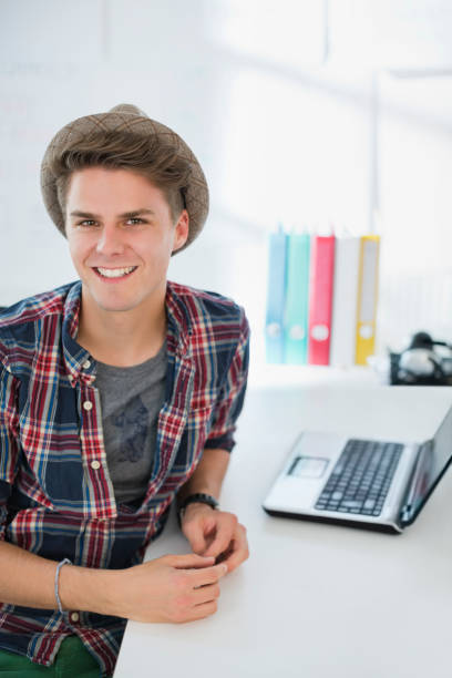istock Businessman smiling at desk 164853010